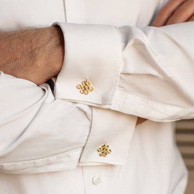 Gold knot cufflinks styled with formal men’s suit